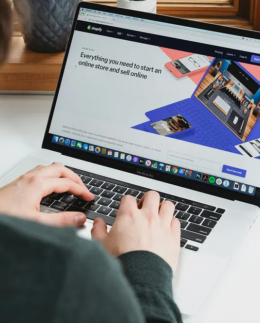 a MacBook with code on the screen
